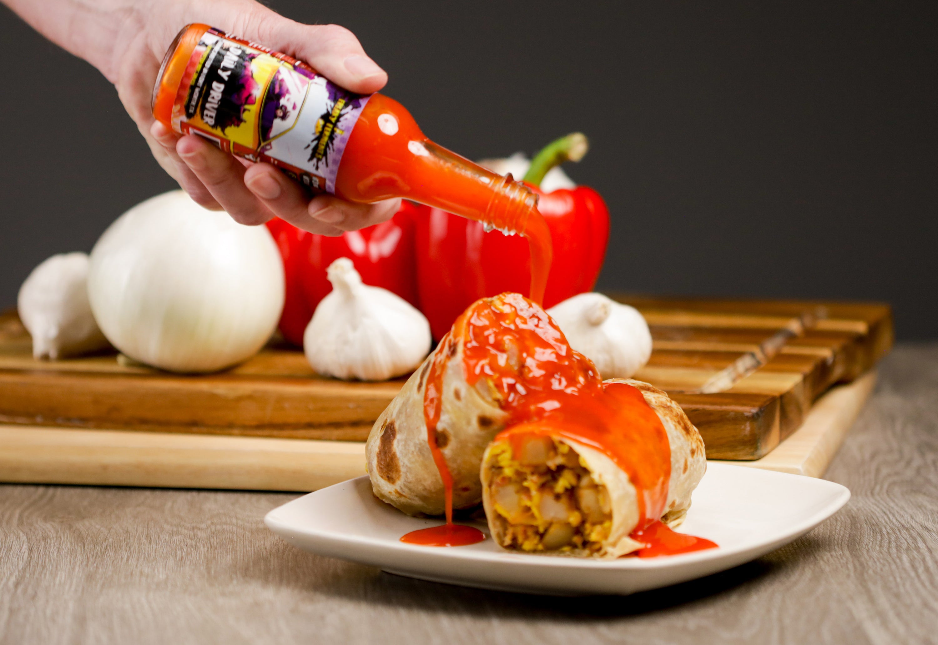 photo of Daily Driver being poured on a breakfast burrito